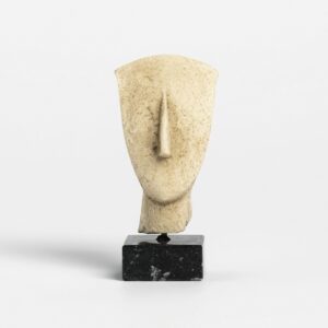 Minimalist stone sculpture of stylized human head