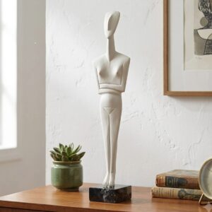 Minimalist abstract female sculpture on wooden table