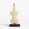 Abstract stone torso sculpture on black base