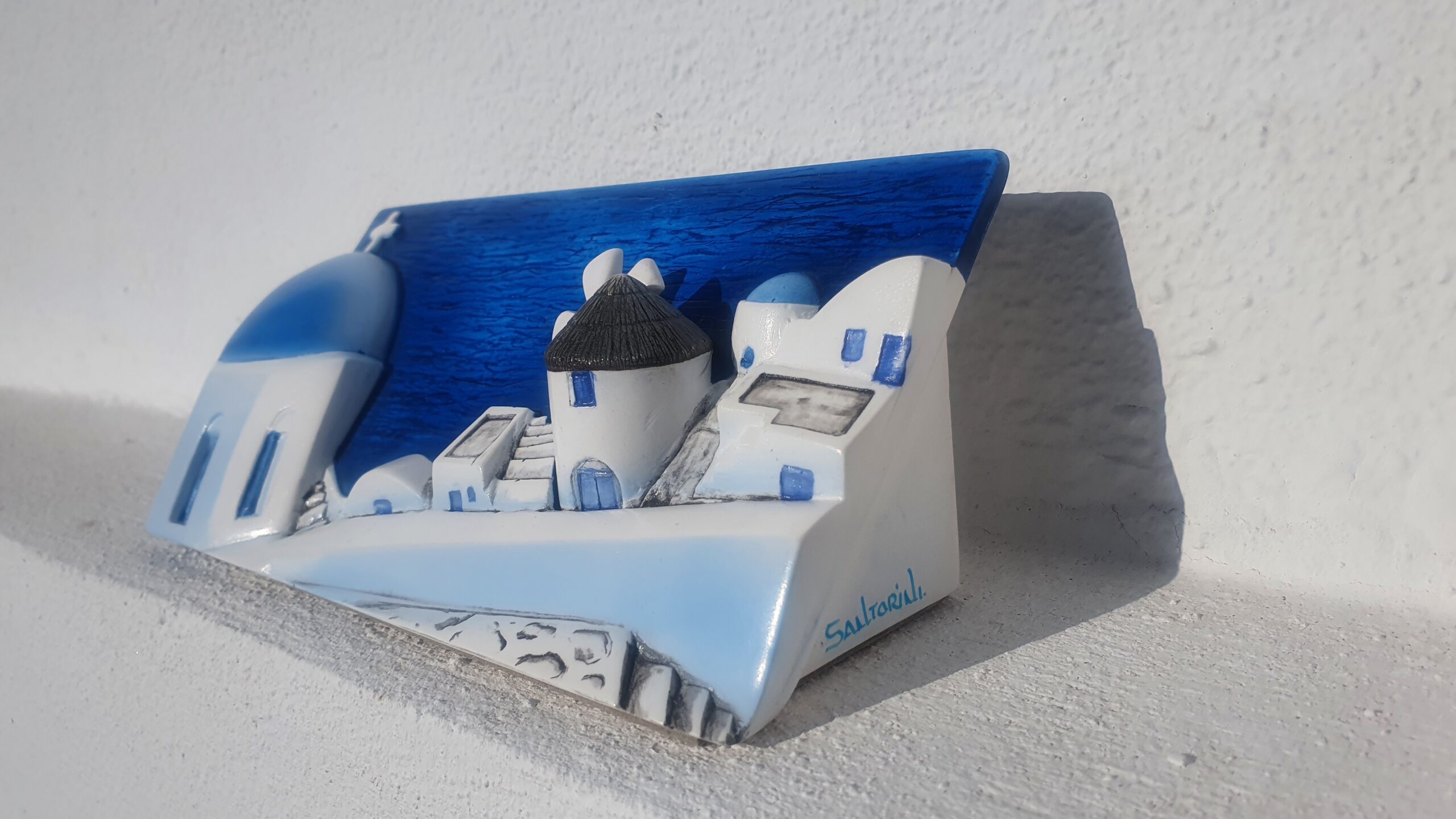Santorini miniature with white buildings and blue domes