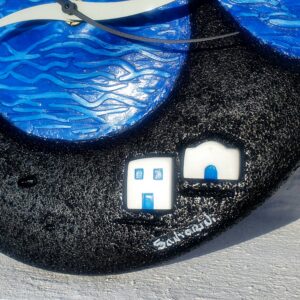 Decorative blue wave wall clock with small houses