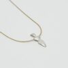 Gold chain with silver abstract bird pendant