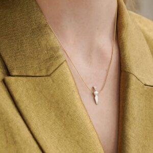 Gold necklace with small white pendant