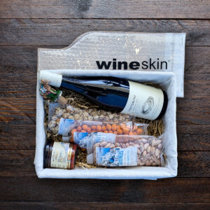 Wine gift basket with snacks and wineskin