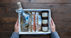 Gift basket with Greek snacks and ouzo bottle