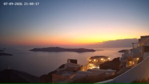 Sunset over coastal village and island seascape