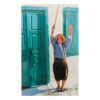 Elderly man with cane by turquoise doors