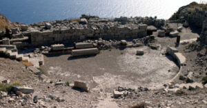 Ancient stone amphitheater ruins overlooking the sea