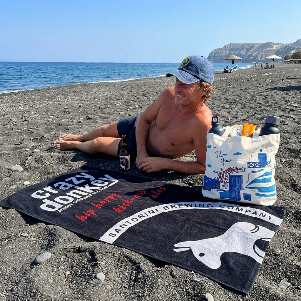 Man relaxing on black sand beach with beer