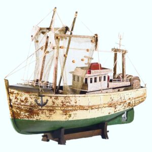Vintage model fishing boat with nets and weathered paint