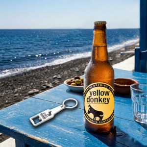 Cold beer bottle on seaside table