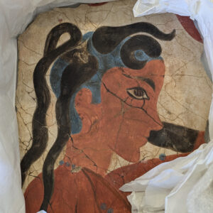 Ancient fresco fragment of woman in profile