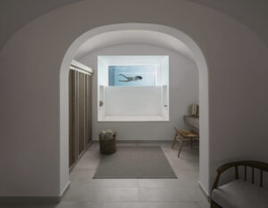 Minimalist spa room with underwater pool window