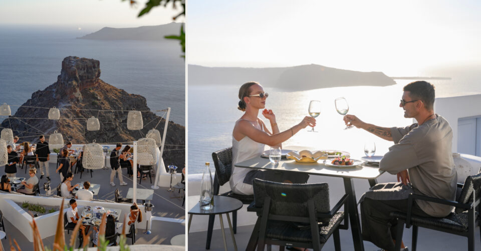 Couple toasting at sunset restaurant overlooking Santorini sea