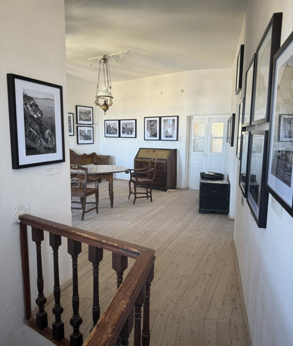 Historic room with vintage furniture and framed photographs