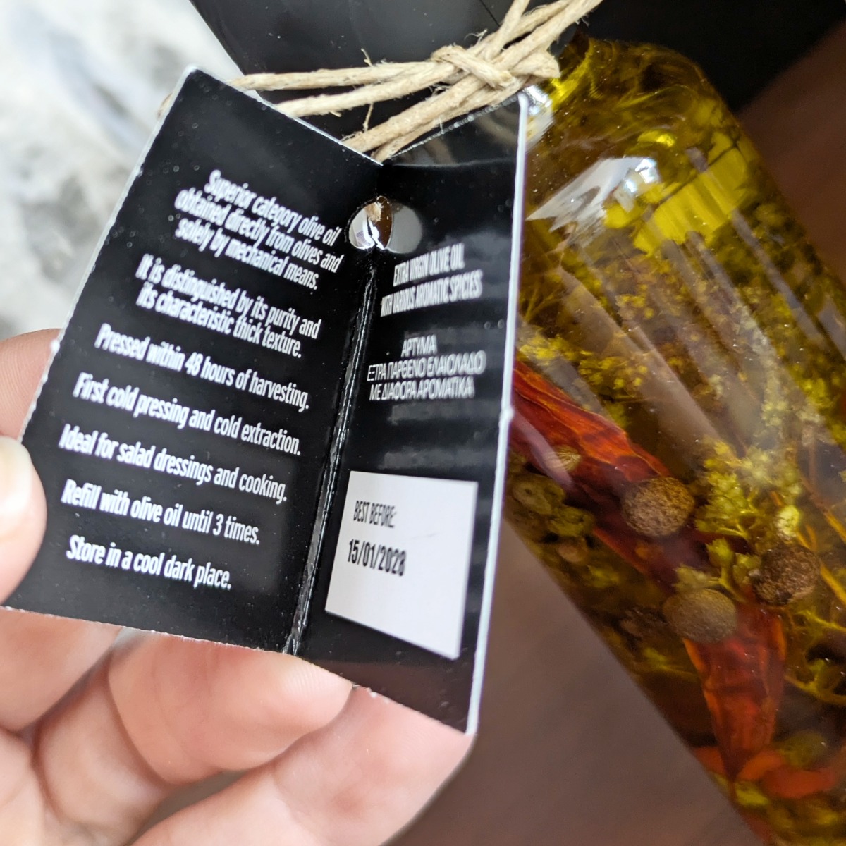Bottle of extra virgin olive oil with spices