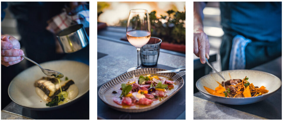 Chef plating gourmet dishes with wine pairing