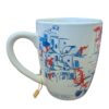 White ceramic mug with blue village illustration