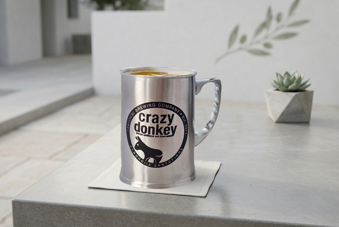 Metal mug with Crazy Donkey logo on counter