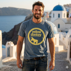 Smiling man in Santorini wearing Yellow Donkey shirt